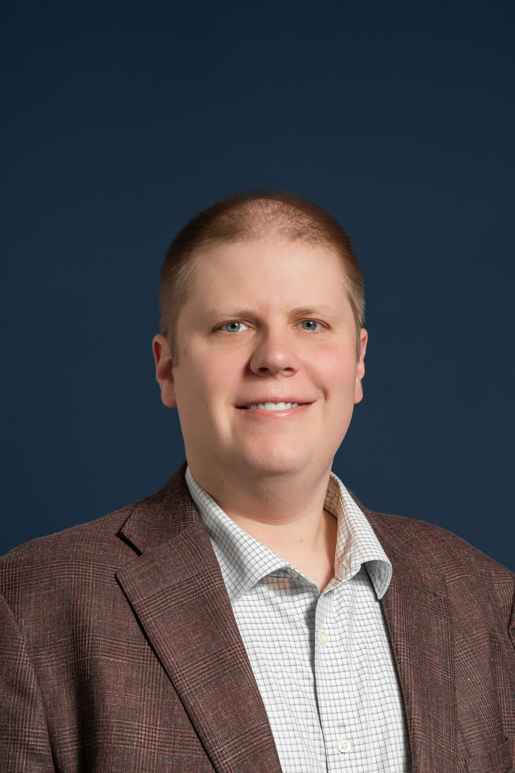 A headshot of Ken Orth