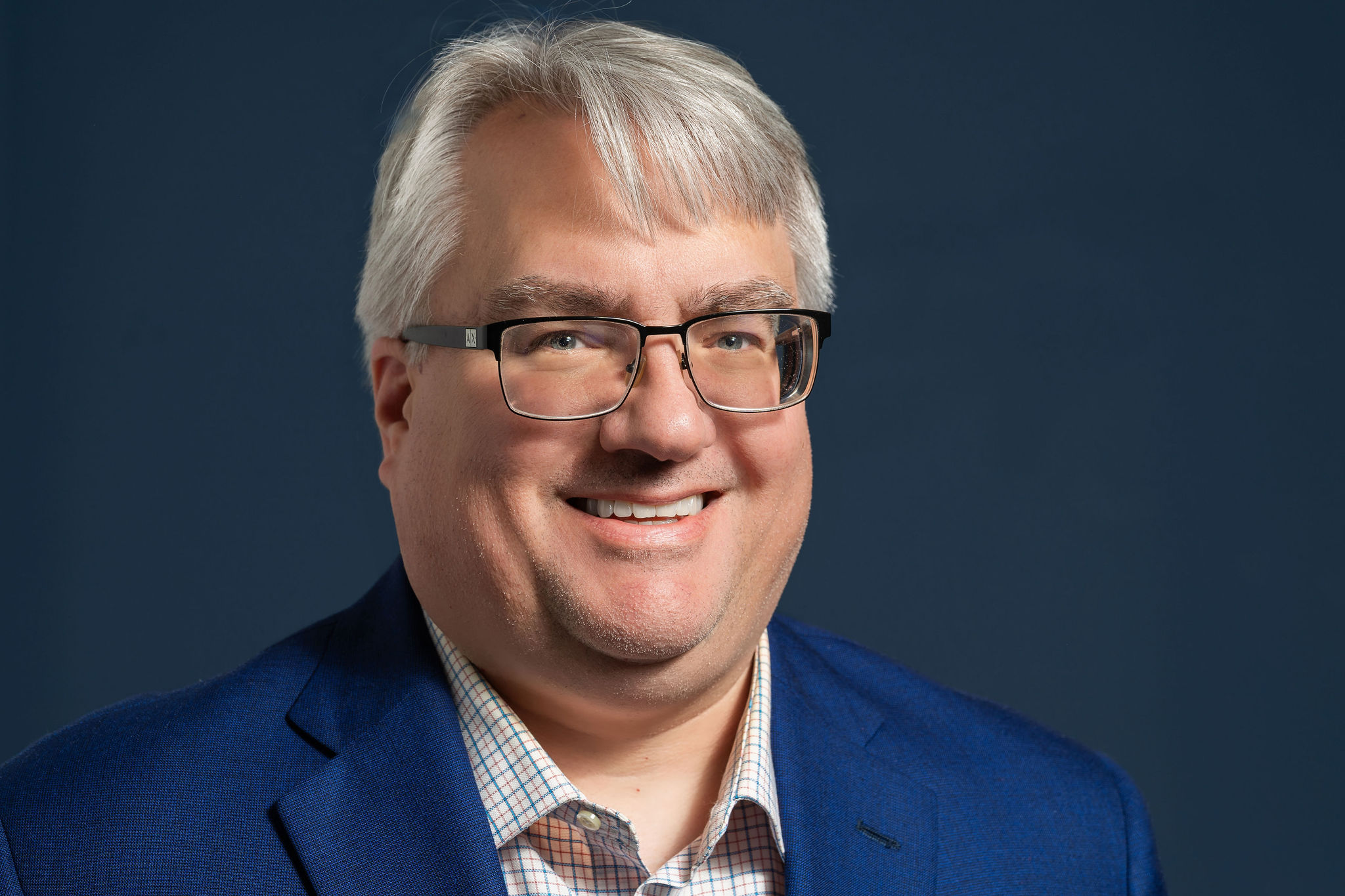 A headshot of Greg Nelson