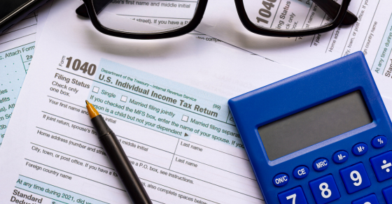 1040 individual tax form a pen a calculator and a pair of glasses one big beautiful bill act individual tax changes