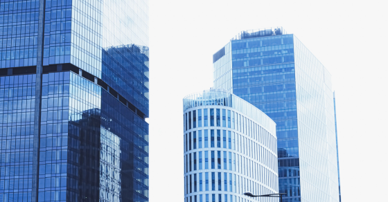 three skyscrapers with a blue hue close up From Real Estate to Startups: 5 Tax Strategies Your Business Needs to Know CJG Partners