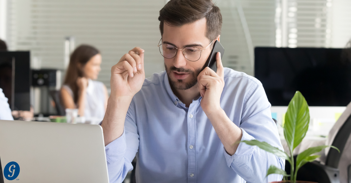 man with glasses and beard on the phone at a desk Is Your CPA Really Looking Out for You