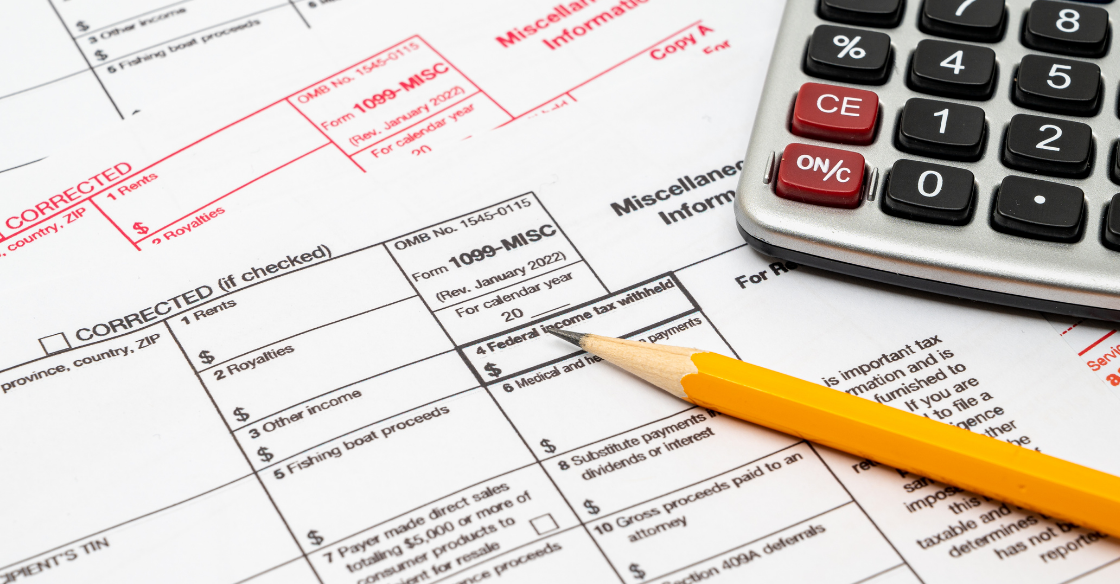 1099 misc form pencil and calculator Stop Scrambling: How to Prepare Your Business for Tax Season