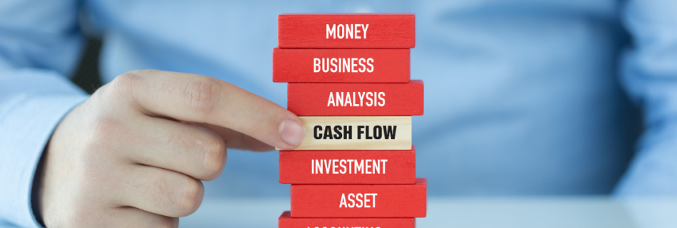 stack of blocks with words and a finger pointing to cash flow cjg partners accounting firm schaumburg