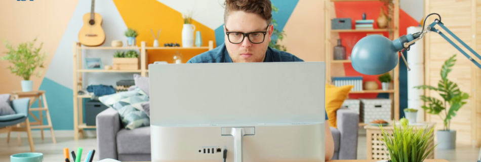 man working at a desk in a home office tax deductions cjg partners cpa accounting