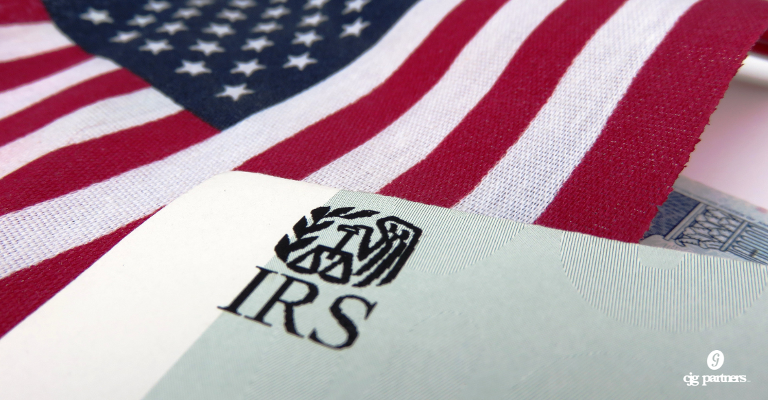 US flag over the IRS logo How to Protect Your Business Expense Deductions from IRS Scrutiny CJG Partners