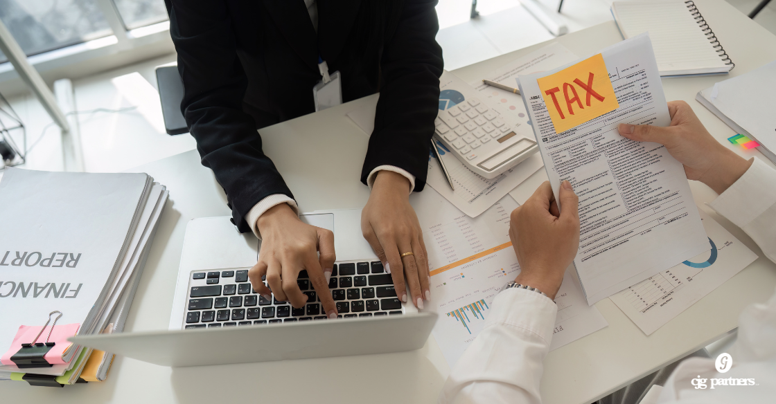 Two people working at a conference table on tax preparation Business Tax Preparation in Schaumburg: What to Expect From a CPA Who Actually Knows Your Business business tax preparation Schaumburg
