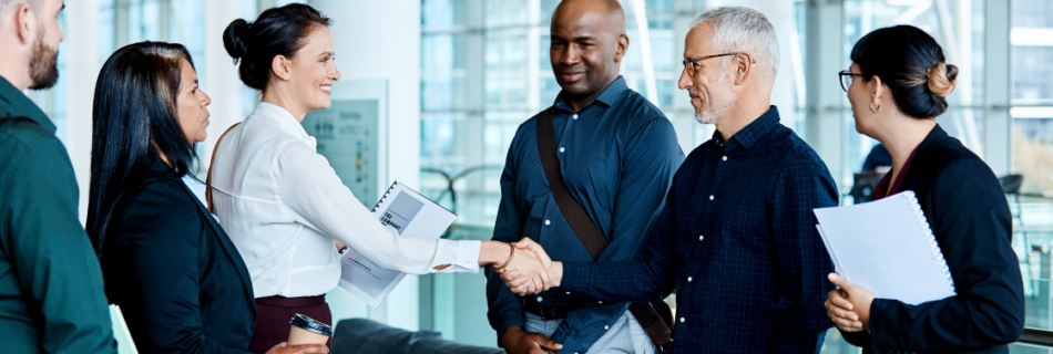three people facing three other people and one person from each group is shaking hands and they are in an office setting What to Know Before You Buy or Sell a Business